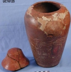 Dynasty 12, red burnished canopic jar decorated in low relief UC16125 - Copyright of the Petrie Museum of Egyptian Archaeology, UCL